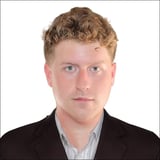 Professional headshot portrait of Christopher Sumner, Co-Founder and CEO of NexoFlow